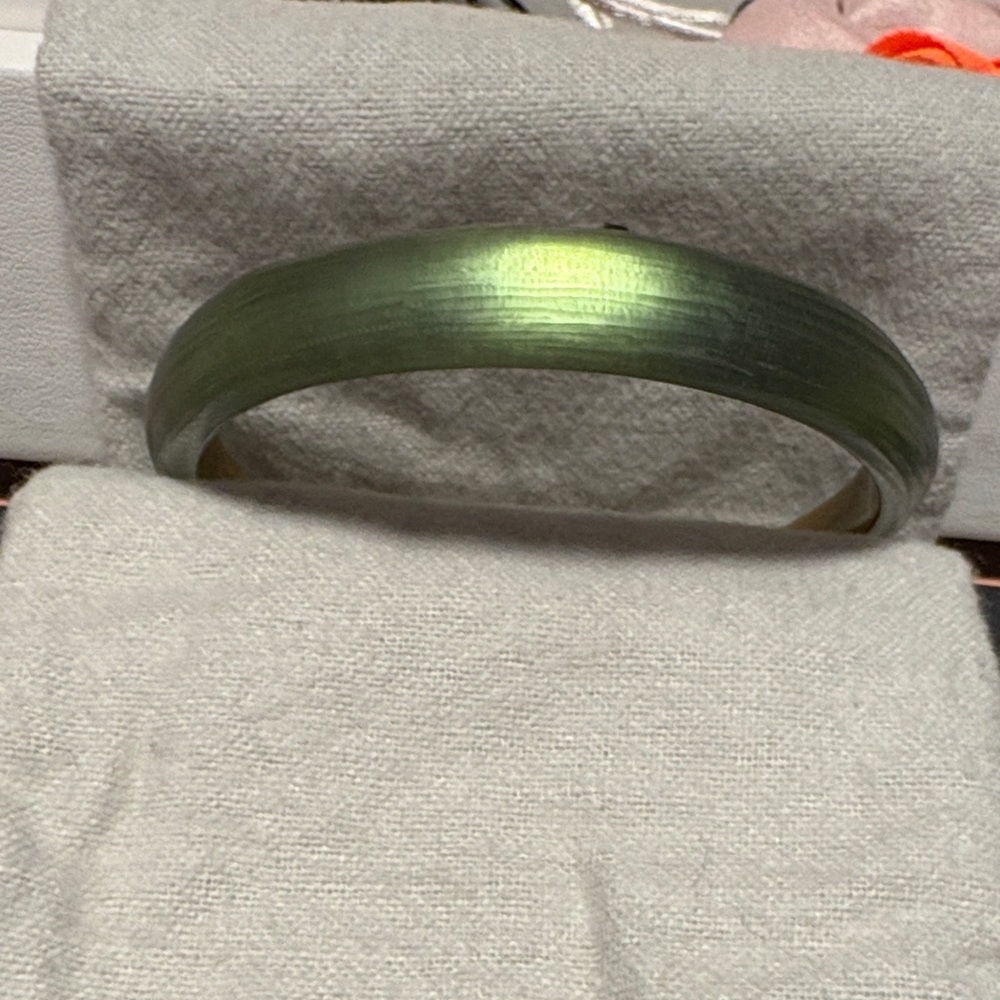 Alexis Bittar tapered bangle bracelet.